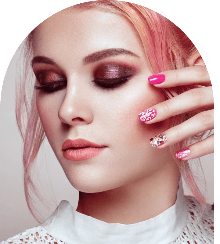 A woman with pink hair and pink nails.