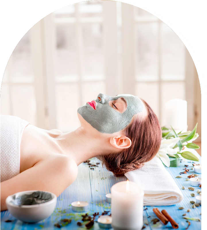 A woman with facial mask on laying down.